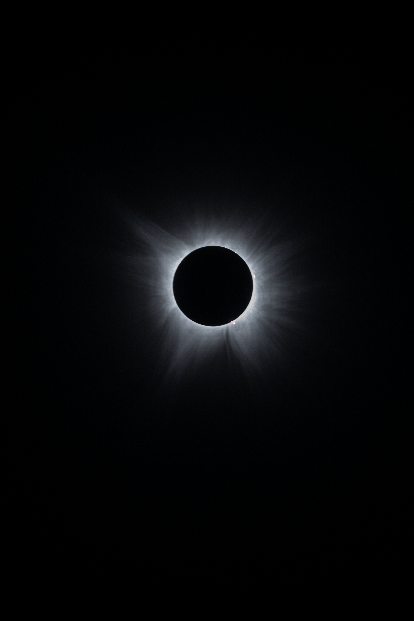 The complete solar corona during totality against deep space