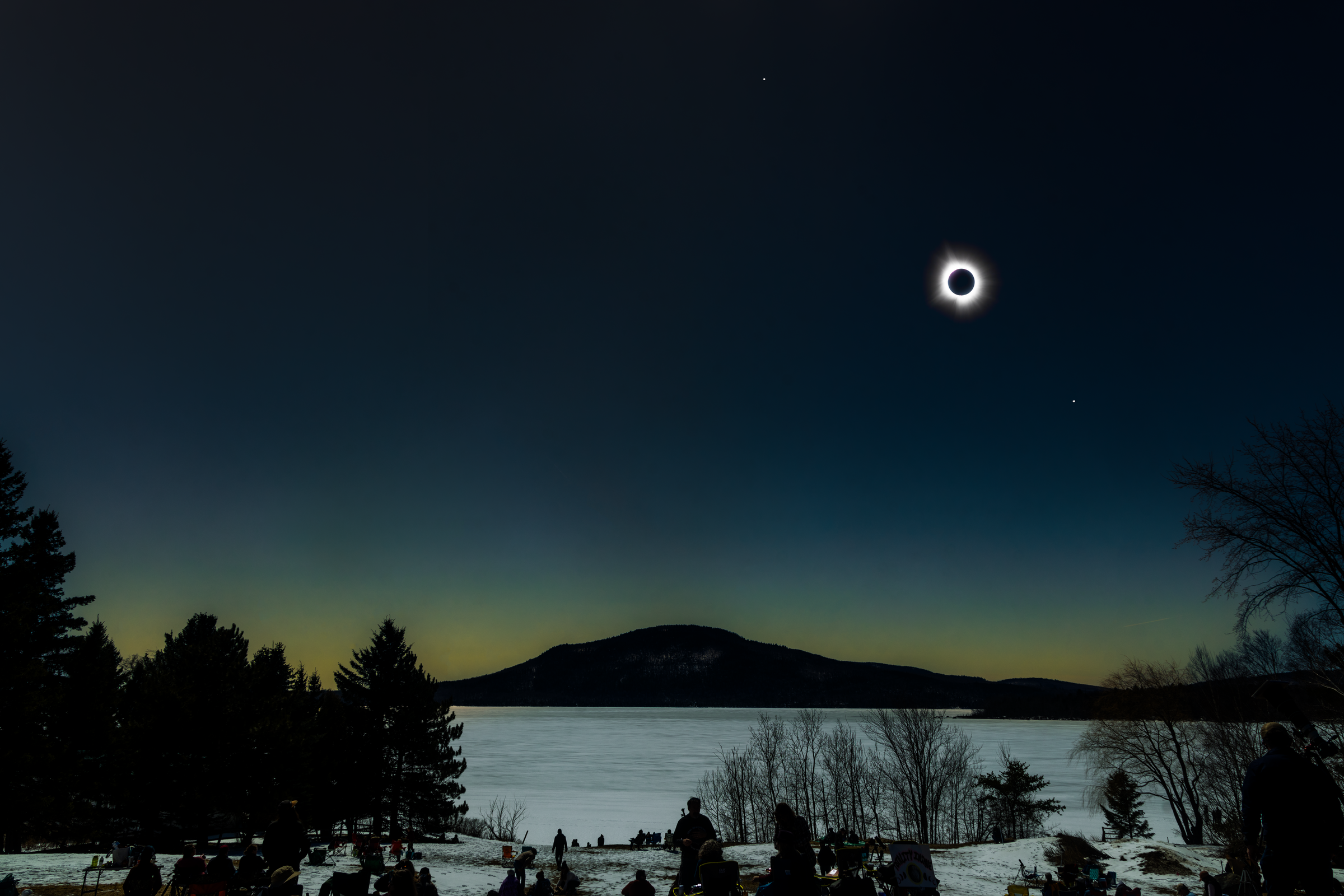 Totality over the frozen lake in Maine
